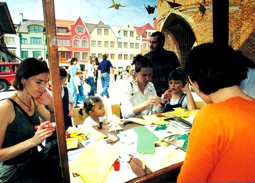 Children learning to create the works from the paper (origami) on the occasion of the open house