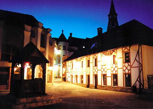 The bell tower in the evening in front of the German House