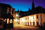 The bell tower in the evening in front of the German House